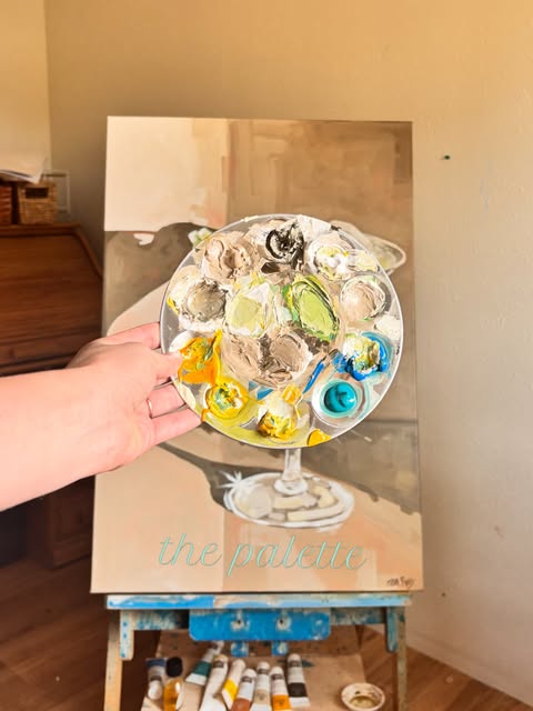 Painting titled the palette, a paint palette on a wine glass